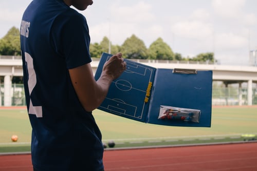 Coach with clipboard